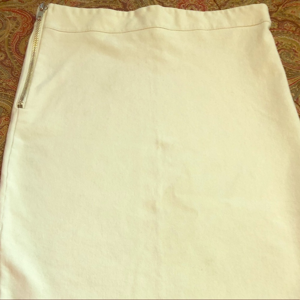 White form fitting white mid length skirt